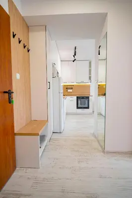 a small kitchen with a refrigerator and a counter at Next to Harmanite Beach - 1 BD Flat with Own Parking spot by Flat Mаnager in Sozopol