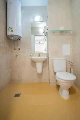 a bathroom with a toilet and a sink at Next to Harmanite Beach - 1 BD Flat with Own Parking spot by Flat Mаnager in Sozopol