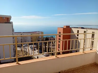 a balcony with a view of a parking lot at Imperial Fort Club in Sveti Vlas