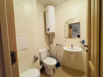 a small bathroom with a toilet and a sink at KALIA C4 One Bedroom Apartment Sunny Beach in Sunny Beach