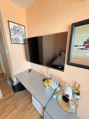 a desk in a room with a large mirror at Sunny Beach Vila in Sunny Beach