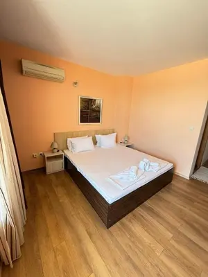 a bedroom with a large bed in a room at Sunny Beach Vila in Sunny Beach