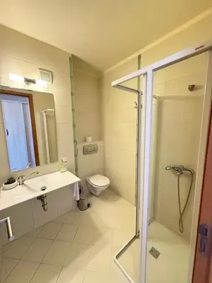 a bathroom with a toilet and a sink and a shower at Sunny Beach Vila in Sunny Beach