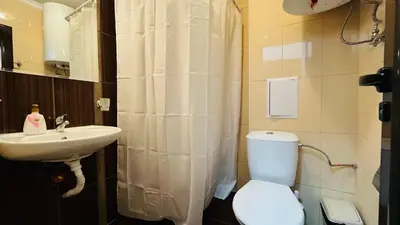 a bathroom with a toilet and a sink at ASTORIA II Apartment 13 One Bedroom Parter in Elenite