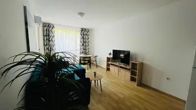 a living room with a couch and a tv at ASTORIA II Apartment 13 One Bedroom Parter in Elenite