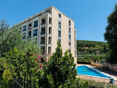 an apartment building with a swimming pool and trees at ASTORIA II Apartment 13 One Bedroom Parter in Elenite