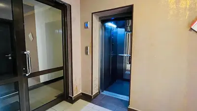 a glass door to a shower in a building at ASTORIA II Apartment 23 One Bedroom in Elenite
