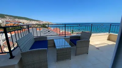 a balcony with a table and chairs and the ocean at Ipanema Beach - new - luxury first line - sea view in Sveti Vlas