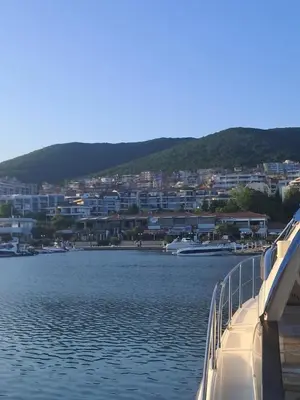 a boat in a body of water with a city at Yacht Port apartment #sea view# in Sveti Vlas
