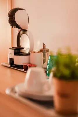 a counter top with dishes and a coffee maker at Apartment Lotus in Sveti Vlas