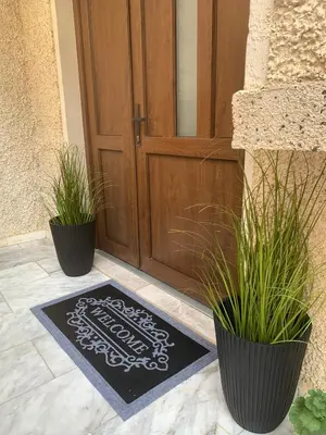 a welcome mat in front of a door at Apartment Lotus in Sveti Vlas