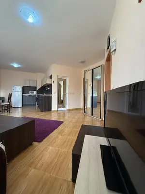 an empty living room with a kitchen and a living room at Sky dreams Sveti Vlas in Sveti Vlas