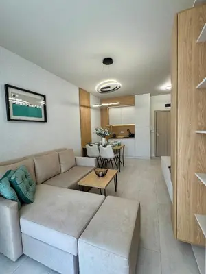 a living room with a couch and a table at Domenico Luxury Apartments in Sunny Beach