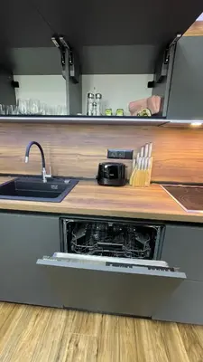 an open oven in a kitchen with a sink at Тони апартмент in Burgas City
