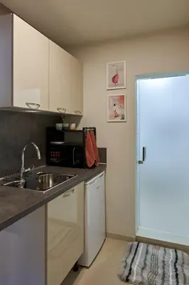 a kitchen with a sink and a microwave at Beauty 2 FREE PARKING in Burgas City
