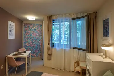 a small room with a table and a window at Beauty 2 FREE PARKING in Burgas City
