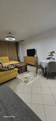 a living room with a couch and a table at Sunny Beach Blue Perl in Sunny Beach