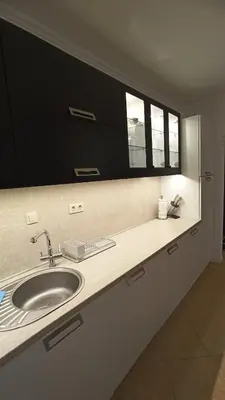 a bathroom counter with a sink and two windows at Premium Oasis Beach Club Apartment in Lozenets