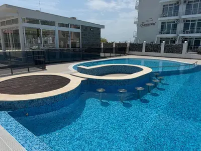 a large swimming pool on top of a building at Grand Villa luxury apartment with sea view in Sveti Vlas