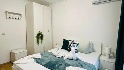 a bedroom with a bed with stuffed animals on it at ASTORIA II Apartment 12 Sveti Vlas in Elenite