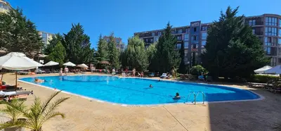 a large swimming pool with people in it at Studio 67 & Apartment 16 Rainbow Holiday Complex in Sunny Beach