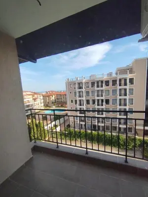 a balcony with a view of a building at Studio Павлови Домус Екстра in Sveti Vlas