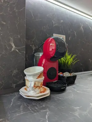 a red mixer sitting on top of a counter at Apartment Dimanov 1 in Burgas City