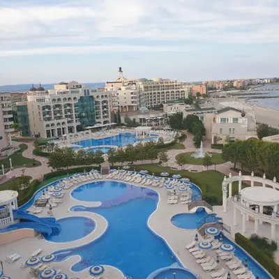 an aerial view of a resort with a pool and chairs at Apartment Sunset resort C4-17 in Pomorie