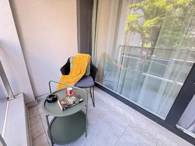 a room with a table and a window at Infinity Apartament in Burgas City