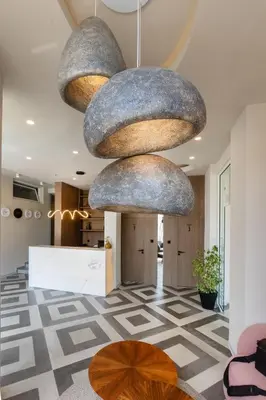 a lobby with large rocks hanging from the ceiling at Hotel Sea Sand in Sveti Vlas