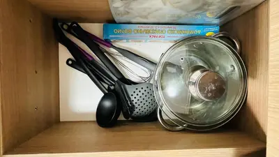 a drawer filled with utensils and a container at FREGATA STUDIO 4 Sveti Vlas in Sveti Vlas