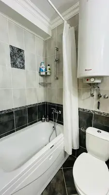 a bathroom with a tub and a toilet and a sink at FREGATA STUDIO 4 Sveti Vlas in Sveti Vlas