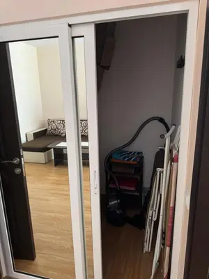 a room with a door open to a room with a couch at Центр солнечного берега in Sunny Beach