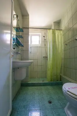 a bathroom with a shower and a sink and a toilet at Guest House ,, Ekaterina