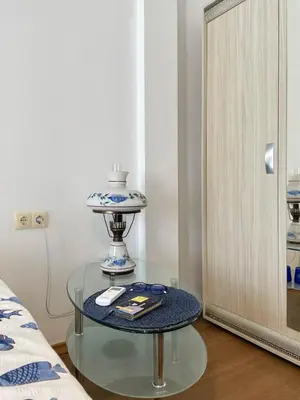a glass table in a room with a mirror at Cozy apartment on Sunny Beach in Sunny Beach