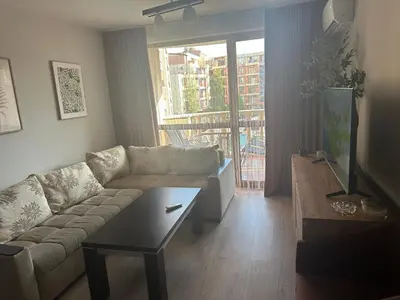 a living room with a couch and a coffee table at Kalia A7 Sunny Beach in Bŭnzareto