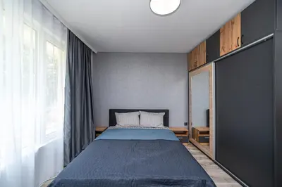 a bedroom with a bed and a large window at Apartment D9 Yassen HV in Sunny Beach