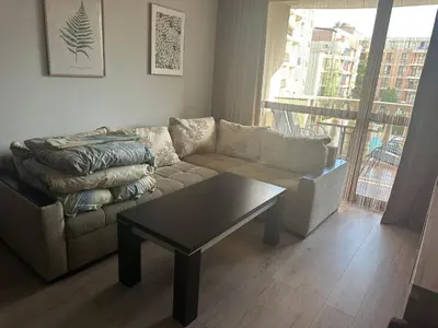 a living room with a couch and a coffee table at Kalia A7 Sunny Beach in Sunny Beach