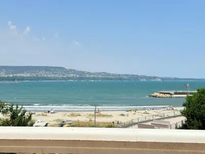 a view of a beach and the ocean at ViolaSuite in Varna South Bay by RV Apartments in Varna City