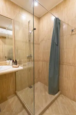 a shower with a glass door in a bathroom at ViolaSuite in Varna South Bay by RV Apartments in Varna City