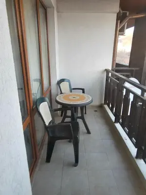 a balcony with a table and chairs on a balcony at Двокімнатна квартира у Panorama Bay 2 в Святому Власі Болгарія in Sveti Vlas