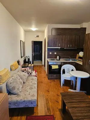 a living room with a couch and a kitchen at Квартира студія у Panorama Bay 2 in Sveti Vlas