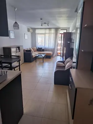 a living room with a couch and a table at PSB Apartments in Etara 2 & 3 Complex Sveti Vlas in Sveti Vlas