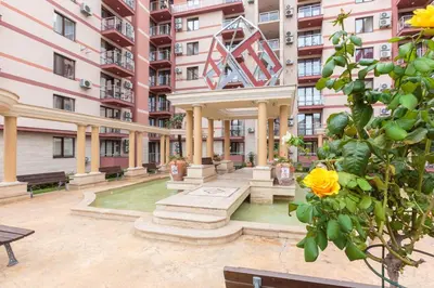a fountain in the courtyard of a building at All-inclusive Holiday Apartments in Tarsis Hotel & Aquapark in Sunny Beach