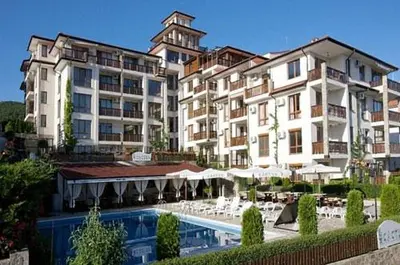 a large building with a pool in front of a resort at Tryavna Beach - Private apartment - BSR - 4 in Sveti Vlas