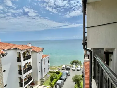 a view of the ocean from the balcony of a building at Tryavna Beach - Private apartment - BSR - 4 in Sveti Vlas