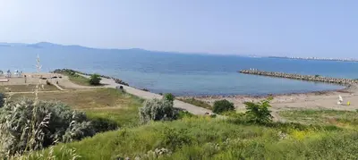 a beach with a large body of water at Sea apartment in Burgas City