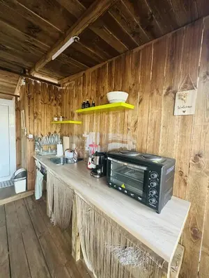a kitchen with a counter with a microwave on it at Каравана Мир in Chernomorets