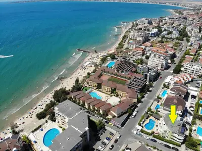 an aerial view of a beach with buildings and the ocean at Семеен Хотел Идън in Sveti Vlas