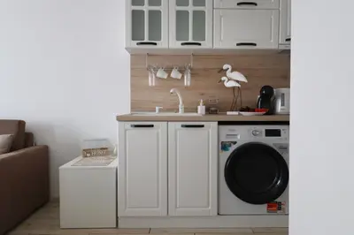 a kitchen with a sink and a washing machine at Stylish Paradiso Apartment 206 in Nesebar